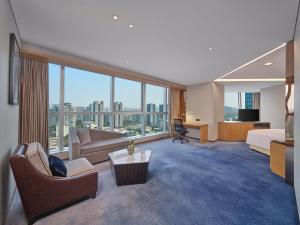 a large hotel room with a view of a city at Hilton Chengdu in Chengdu
