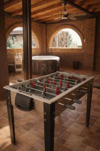 a large pool table with balls on top of it at Hotel Flamora-Valle de Guadalupe in Francisco Zarco