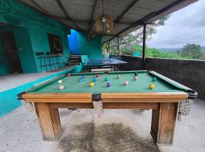 a pool table with balls on top of it at CHÁCARA dos CHEIROS in Atibaia