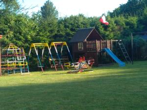 a park with a playground with a slide at Jarek in Pobierowo