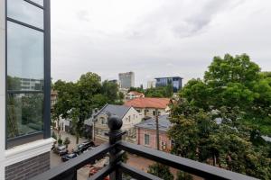 a view of a city from a balcony at Renest Milano Elegance Stay in Chişinău