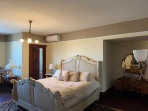a bedroom with a bed with pillows on it at Alden Villa in Lebanon