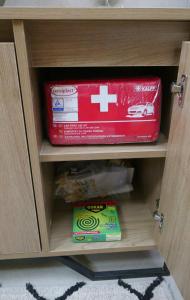 a drawer of a cabinet with a box of food at The Lodge apartment in Mesongi