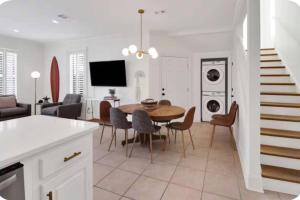 a kitchen and dining room with a table and chairs at Simply Adventurous Too in Mexico Beach +11 photos