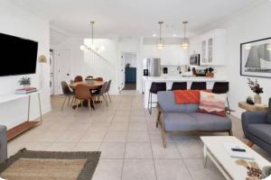 a living room with a couch and a table at Simply Adventurous Too in Mexico Beach