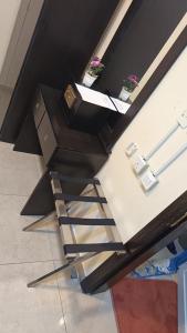 a staircase in a building with a stair case at شقق مساكن الراية المخدومه in Al Khobar +12 photos