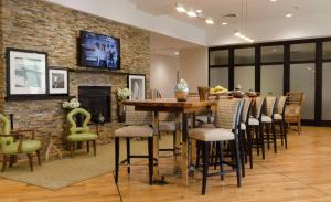 a dining room with a table and chairs at Hampton Inn Hickory in Hickory