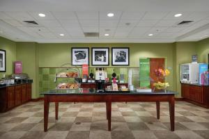 a store with a counter with a display in a room at Hampton Inn Bermuda Run / Advance in Bermuda Run +27 photos