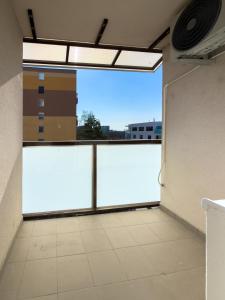 an empty room with a large window in a building at The Elegant Hideaway in Šurany