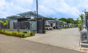 a row of houses with a parking lot at Casamar in Uvita