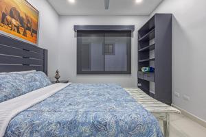 a bedroom with a large bed and a window at Casamar in Uvita +2 photos
