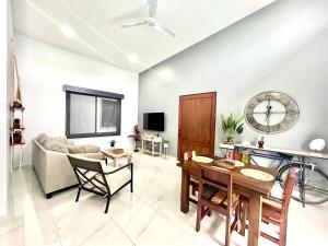 a living room with a couch and a table at Casamar in Uvita