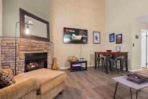 a living room with a couch and a fireplace at Sigi's Longhorn Lodge WL1409 Gym Ski Powder Mtn in Eden