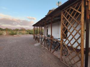 a barn with a bike parked outside of it at Luna Atacama in San Pedro de Atacama