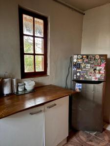 a kitchen with a refrigerator and a window at Luna Atacama in San Pedro de Atacama +20 photos