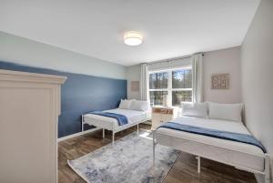 a bedroom with two beds and a window at Coastal Maine Escape in Ellsworth