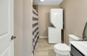 a small bathroom with a toilet and a sink at Coastal Maine Escape in Ellsworth
