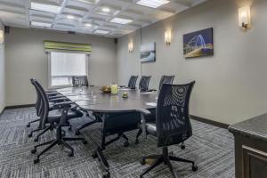 a conference room with a table and chairs at Hampton Inn & Suites Edmonton/West in Edmonton +22 photos