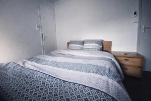 a bedroom with a bed with two pillows on it at Chez ValJean in Châlus