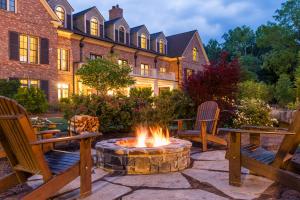 a fire pit in a yard in front of a building at Barnsley Resort in Adairsville