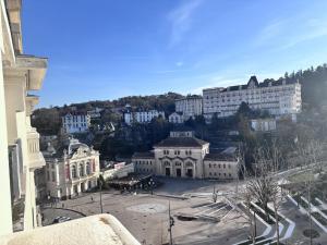 a view of a city with buildings and a street at Nuit Panoramique - Studio - Wifi - 2 pers in Châtel-Guyon