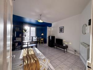 a living room with a bed and a dining room at Nuit Panoramique - Studio - Wifi - 2 pers in Châtel-Guyon