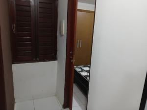 a mirror in a room with a door and a closet at Casa praia de Barra nova 6 km de Maceió in Marechal Deodoro +31 photos