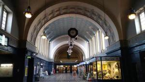 a large building with a clock hanging from the ceiling at Dachgeschosswohnung in historischem Monument in Görlitz +9 photos