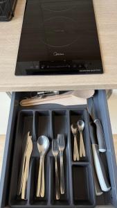 a tray with utensils in a drawer at Makosieje Resort-15m od brzegu,widok na jezioro,wi-fi in Makosieje