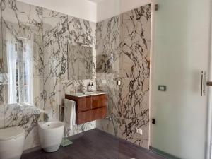 a bathroom with a sink and a mirror at Perla di Mare in Martinsicuro +26 photos
