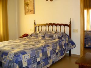 Postel nebo postele na pokoji v ubytování Hotel Álvarez
