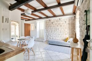 a living room with a couch and a table at Best view! Rooftop with Garden - Old Town Nr404 in Kotor