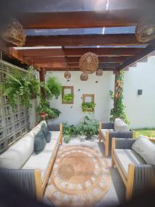 a living room with couches and a table at Recanto dos Maias in Aracaju