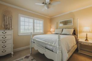 a bedroom with a white bed and a window at The Vineyard Farmhouse Villa in Paso Robles +47 photos