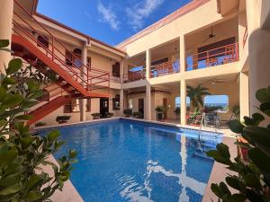 a swimming pool in the middle of a house at St. Francis Suite in San Juan del Sur