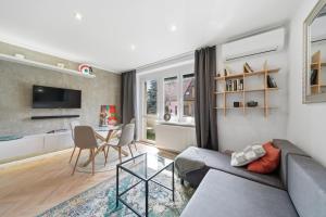 a living room with a couch and a table at Haban Haus in Bratislava