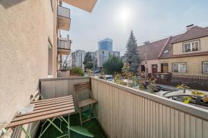 a bench sitting on the balcony of a building at Haban Haus in Bratislava