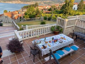 a table with food on top of a patio at Casa Abuela Julia in Poio