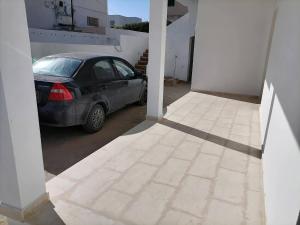 a car parked in a parking lot in a garage at Villa blanche sfax in Sfax