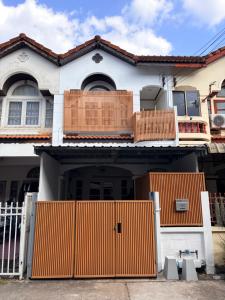 a house with an orange gate in front of it at Downtown Entire House - Mae Moli in Chiang Mai