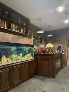 a kitchen with a fish tank and a counter at Villa Rinat Boutigue Hotel in Kyiv +35 photos