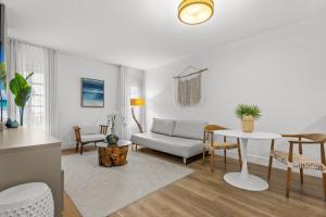 a living room with a couch and a table at Bentley Hotel South Beach in Miami Beach
