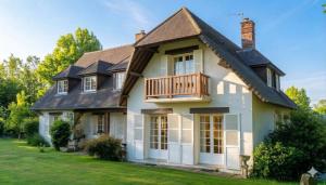 a house with a porch and a deck at Bed and Breakfast Saultchevreuil in Villedieu-les-Poêles