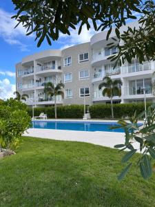a large apartment building with a swimming pool at Victoria's home near the beach with Swimming pool and elevator in Punta Cana