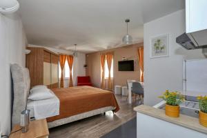 a hotel room with a bed and a sink at Rooms & Apartments 72 in Zadar