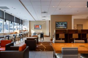 a dining room with a table and chairs at Calgary Marriott Downtown Hotel in Calgary