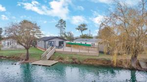 a house with a slide in the middle of a lake at 3 Bed in Tallington oc-s30309 in Yaxley