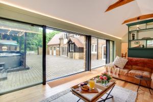 a living room with large sliding glass doors at 4 Bed in Broadstairs oc-w28331 in Broadstairs