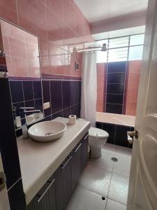 a bathroom with a sink and a toilet at Refugio del Lago in Puno