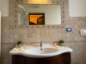 a bathroom with a sink and a mirror at Il "Nido di Achille" in Centro - 2 piani di privacy e massimo comfort! in Terni +52 photos